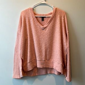Woman’s Forever 21 pink sweater